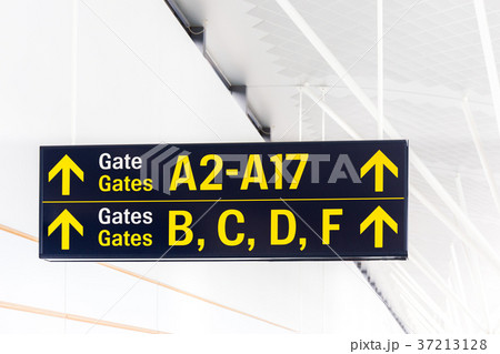 Gate label with arrow in terminal of airport 37213128
