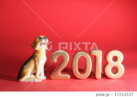 Dog with year 2018 on red background Dog with year 2018 on red background 37213537