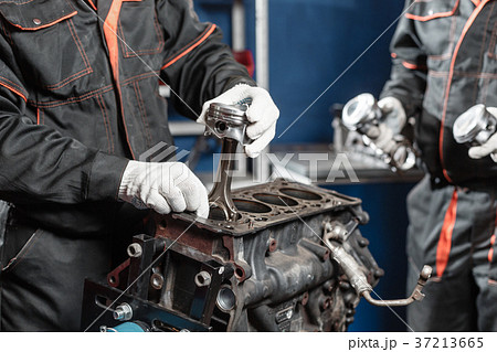 the mechanic installs a new piston. Disassemble the mechanic installs a new piston. Disassemble 37213665