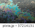 Bright colored chemical waste on the road 37214131