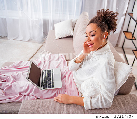 Carefree young woman relaxing with favorite melody 37217707