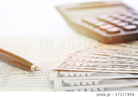 Dollars money and financial statement on table 37217808