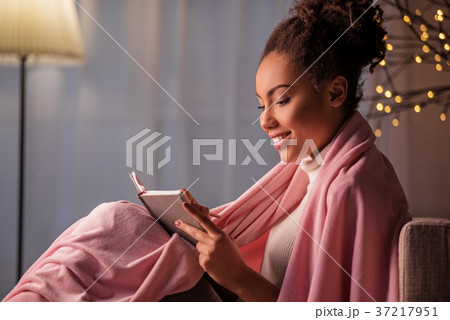 Joyful young woman creating poem with inspiration 37217951