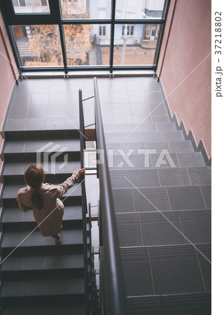 Girl moving on stairs in apartment Girl moving on stairs in apartment 37218802
