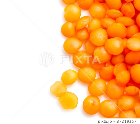 Red lentils on a white background Red lentils on a white background 37219357