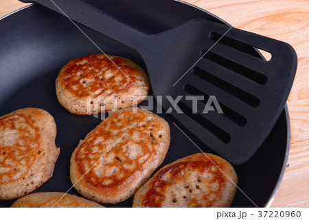 Frying pan with fritters Frying pan with fritters 37220960