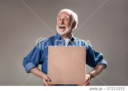 Jolly aging man demonstrating picture frame 37221553