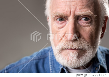 Male pensioner looking with gravity 37221557