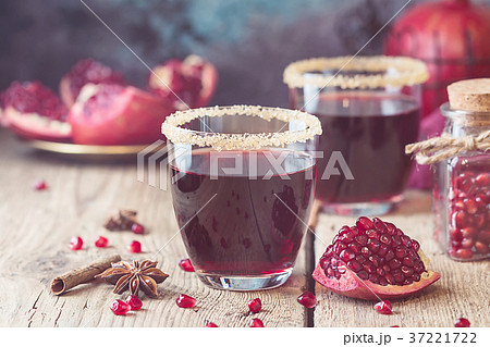 A glass of pomegranate juice 37221722