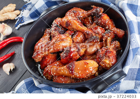 close-up of grilled crispy chicken legs close-up of grilled crispy chicken legs 37224033