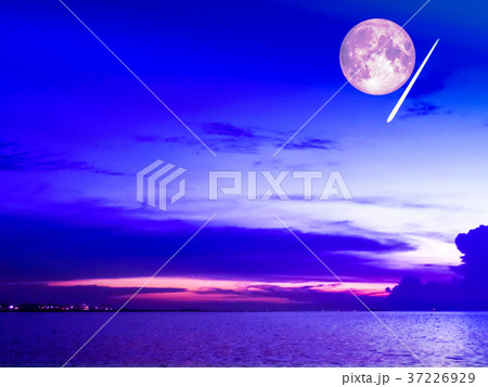 buper moon and meteor fall cold sky over sea 37226929