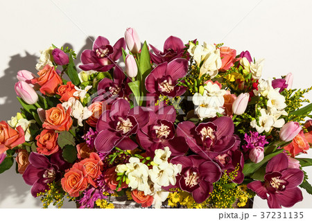 arrangement of flowers from roses, orchids  37231135