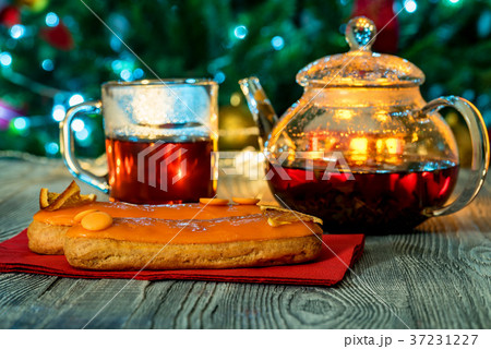 Cozy still life with tea, candle light and eclairs 37231227