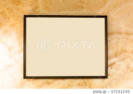 Aged wall texture with blank photo frame 37231250