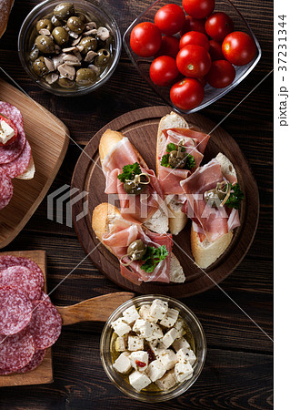 Spanish tapas with slices jamon serrano Spanish tapas with slices jamon serrano 37231344