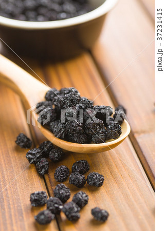 Dried chokeberries. Black aronia berries. Dried chokeberries. Black aronia berries. 37231415