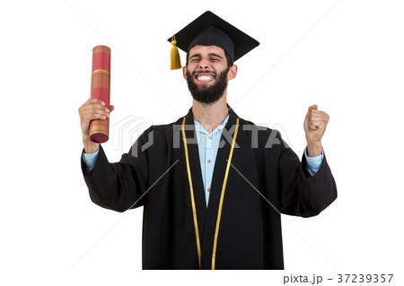 cheerful smiling male graduate wearing gown and cheerful smiling male graduate wearing gown and 37239357