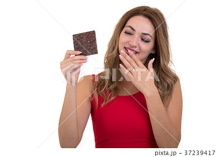 young and beautiful woman eating a delicious dark 37239417