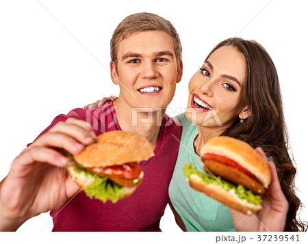 Couple eating fast food. Man and woman eat Couple eating fast food. Man and woman eat 37239541