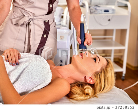 Ultrasonic facial treatment on ultrasound man face 37239552