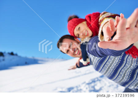 Loving couple playing together in snow outdoor. 37239596