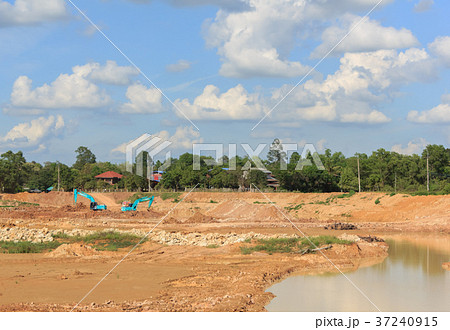 Backhoe dredging swamps for agriculture   37240915