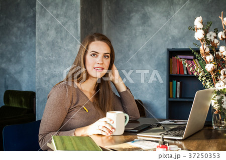 Smiling Woman with Laptop and Graphics Tablet Smiling Woman with Laptop and Graphics Tablet 37250353