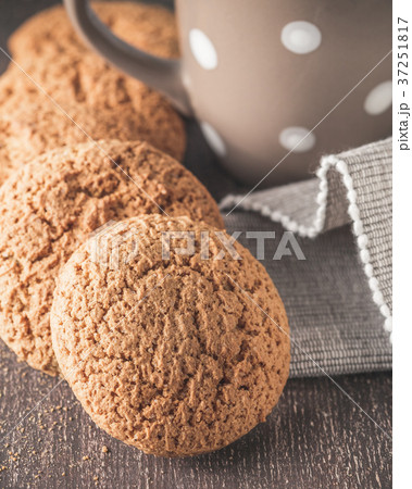 Oat cookies on brown rustic wood with copy space 37251817