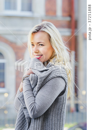 Young stylish woman walking on the city street Young stylish woman walking on the city street 37251888