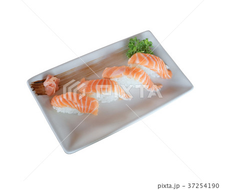 Raw salmon nigiri sushi dish isolated on white. Raw salmon nigiri sushi dish isolated on white. 37254190