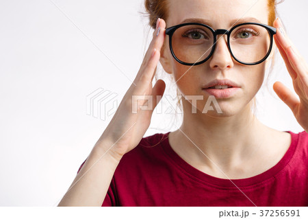 redhead smiling woman wearing red shirt hold 37256591
