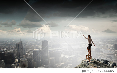 Woman reaching hand up Woman reaching hand up 37266665