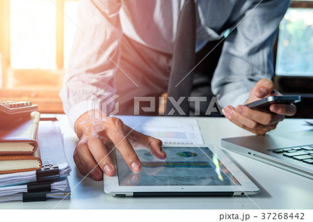 Businessman working with smart phone Businessman working with smart phone 37268442