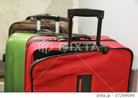 Red broken traveling luggage, crack and torn. Red broken traveling luggage, crack and torn. 37269090