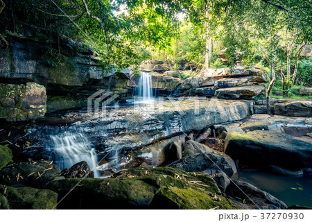 Waterfall in the tropical rain forest 37270930