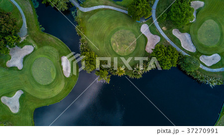 Aerial view of green golf course. 37270991