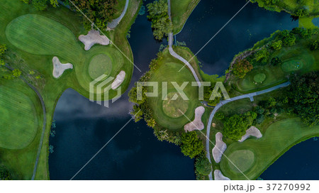 Aerial view of green golf course. 37270992