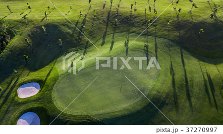 Aerial view of green golf course. 37270997