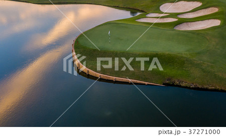 Aerial view of green golf course. 37271000