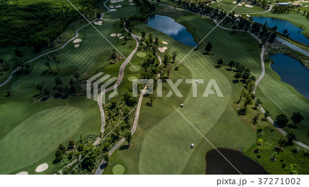 Aerial view of green golf course. 37271002