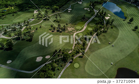 Aerial view of green golf course. 37271004