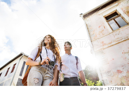 Two young tourists with camera in the old town Two young tourists with camera in the old town 37279837