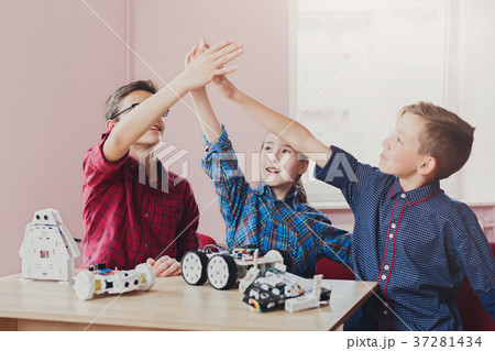 Stem education. Kids creating robots, success Stem education. Kids creating robots, success 37281434
