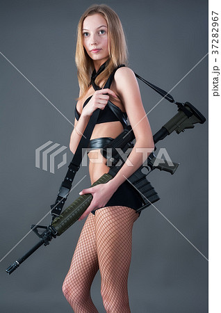 Beautiful girl holding a rifle 37282967