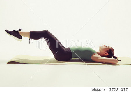 Beautiful slim brunette doing some stretching 37284057