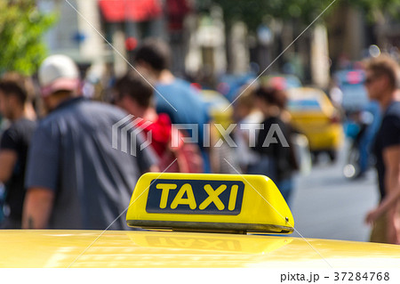 Yellow taxi sign on cab vehicle roof Yellow taxi sign on cab vehicle roof 37284768