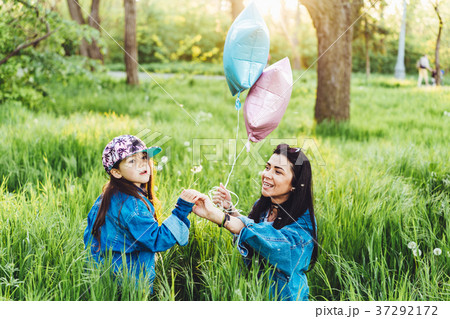 mom andbeautiful girl on the lawn mom andbeautiful girl on the lawn 37292172