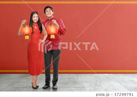 Young chinese couple with traditional dress Young chinese couple with traditional dress 37299791