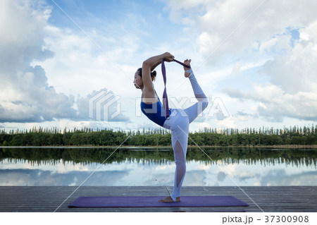 Woman Yoga Strong female action exercise on wooden 37300908