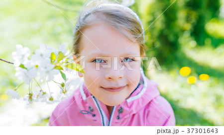 little laughing girl squinting eyes 37301643